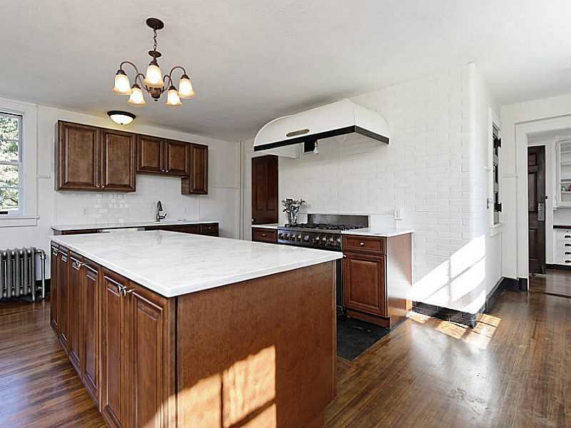 487 North Street Greenwich, CT 06830 - Photo 6 of 10 a kitchen with a cabinets and wooden floor