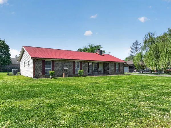 a view of a house with a yard