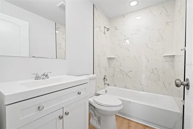 a bathroom with a sink a toilet and a bathtub