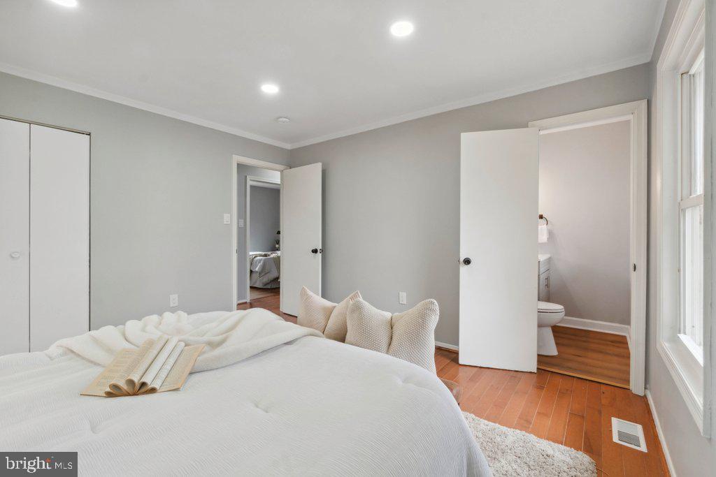 18 Rollwin Road Baltimore, MD 21244 - Photo 19 of 27 a bedroom with a bed and wooden floor