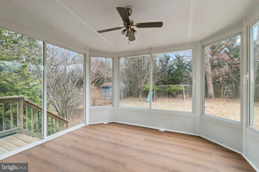 18 Rollwin Road Baltimore, MD 21244 - Photo 21 of 27 a view of empty room with wooden floor and fan