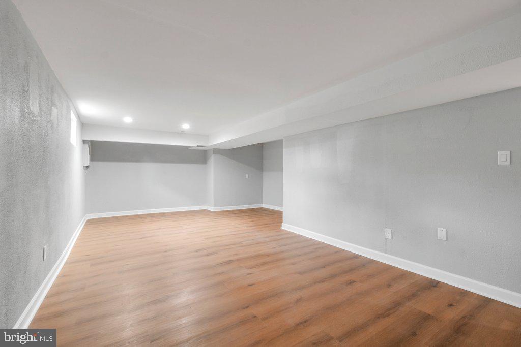 18 Rollwin Road Baltimore, MD 21244 - Photo 24 of 27 a view of an empty room with wooden floor