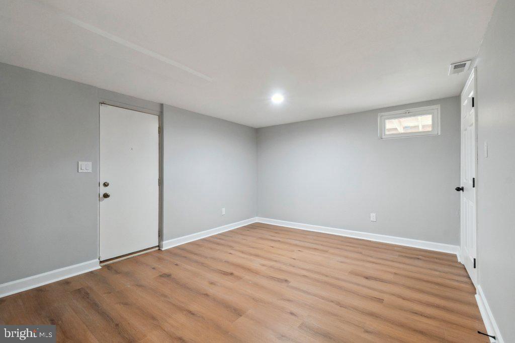 18 Rollwin Road Baltimore, MD 21244 - Photo 25 of 27 wooden floor in an empty room