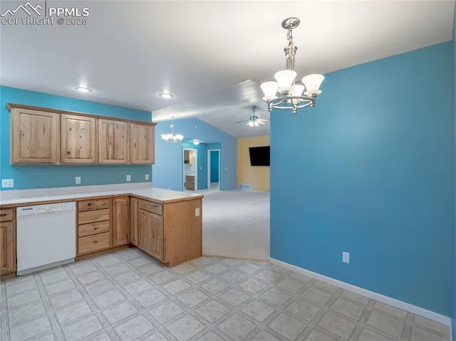 a kitchen with cabinets and window