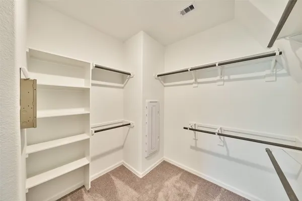 a view of an empty walk in closet
