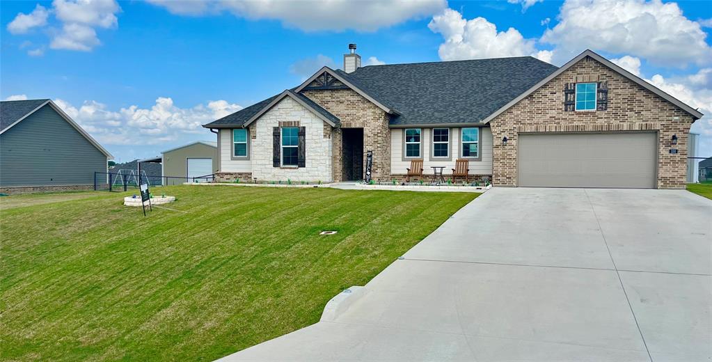 150 Spanish Moss Trail Rhome, TX 76078 - Photo 2 of 30 updated photo of Front yard with Spring Grass