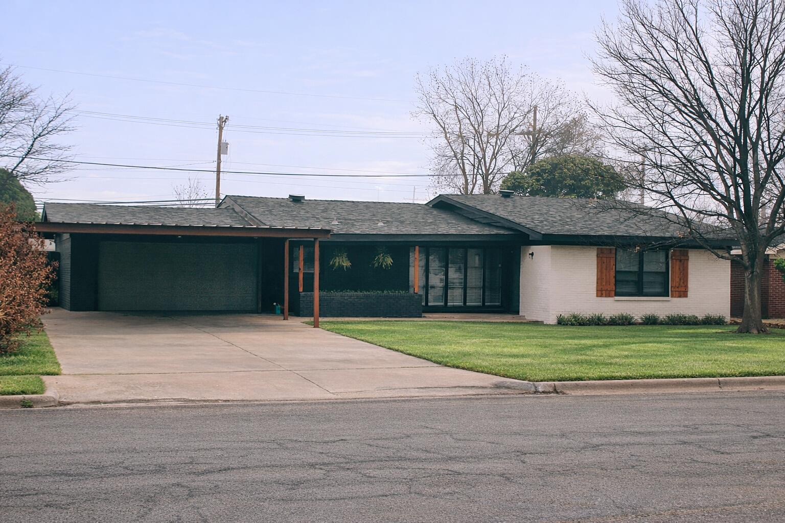 2504 53rd Street Lubbock, TX 79413 - Photo 1 of 28 a front view of a house with a yard and garage