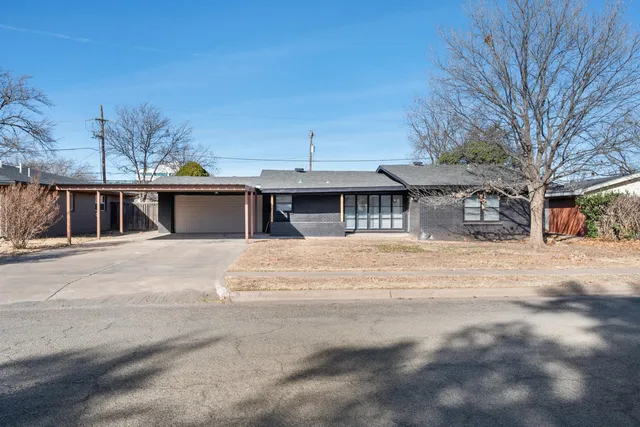 a front view of a house with a garage