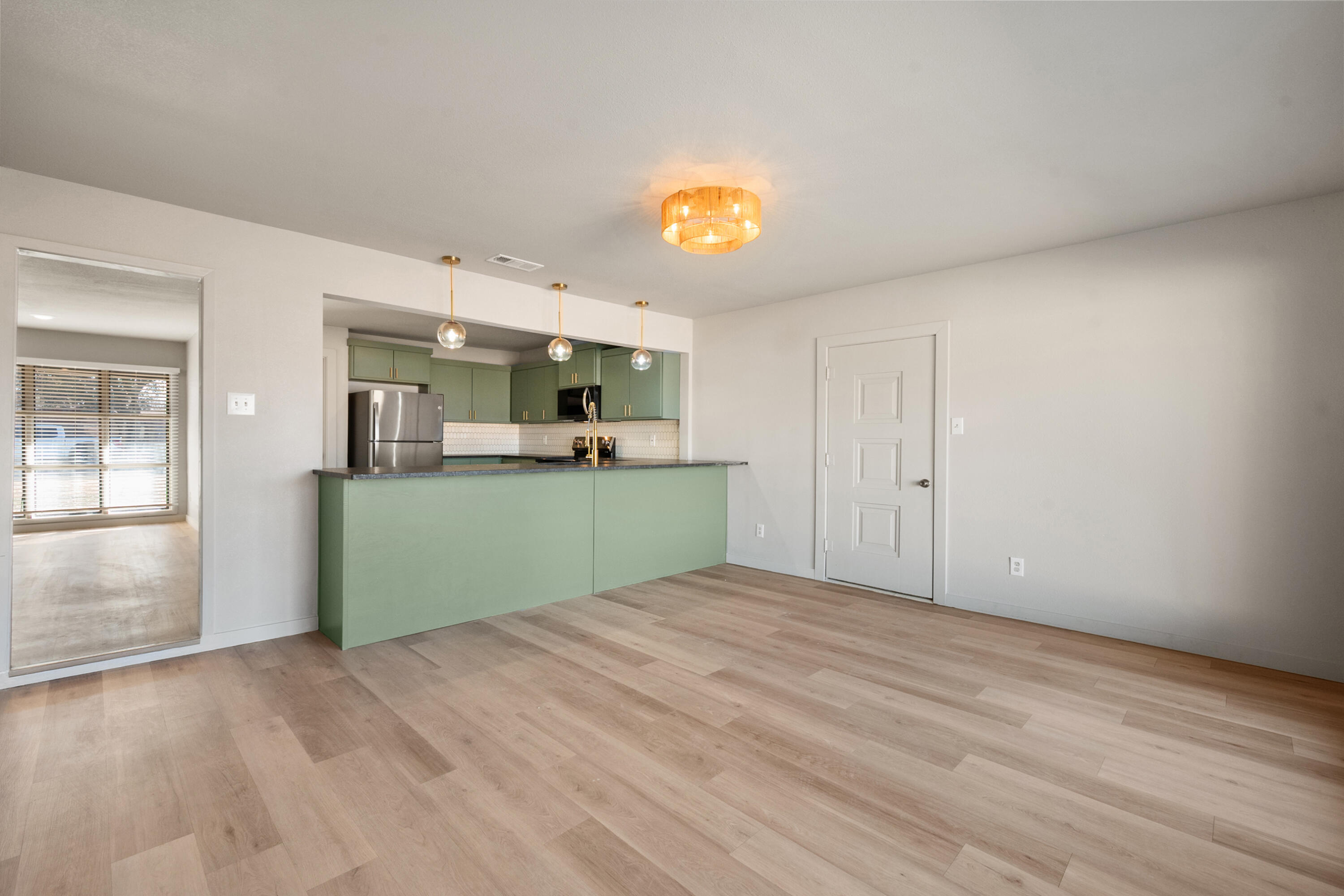 2504 53rd Street Lubbock, TX 79413 - Photo 11 of 28 a view of a kitchen with a sink and a microwave
