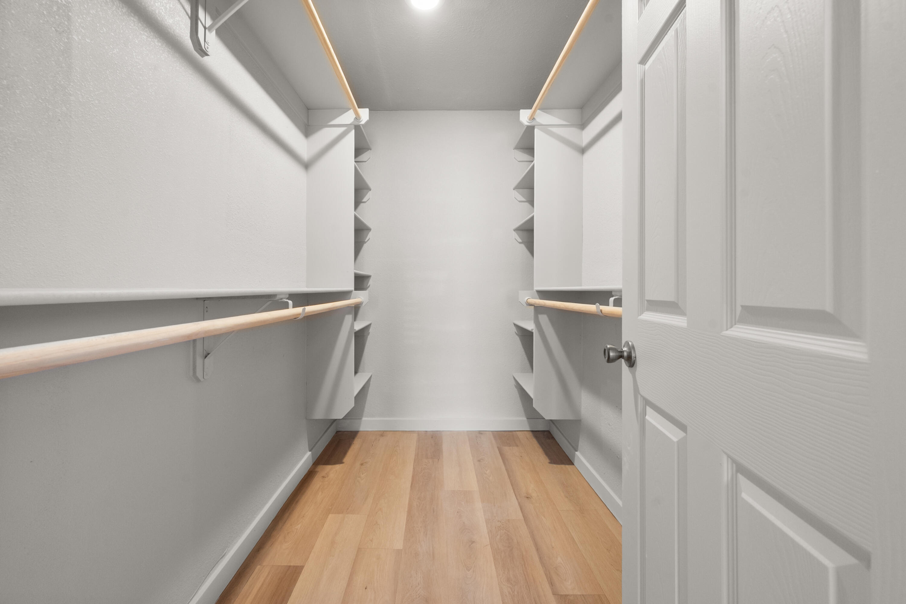 2504 53rd Street Lubbock, TX 79413 - Photo 16 of 28 a view of closet with wooden floor