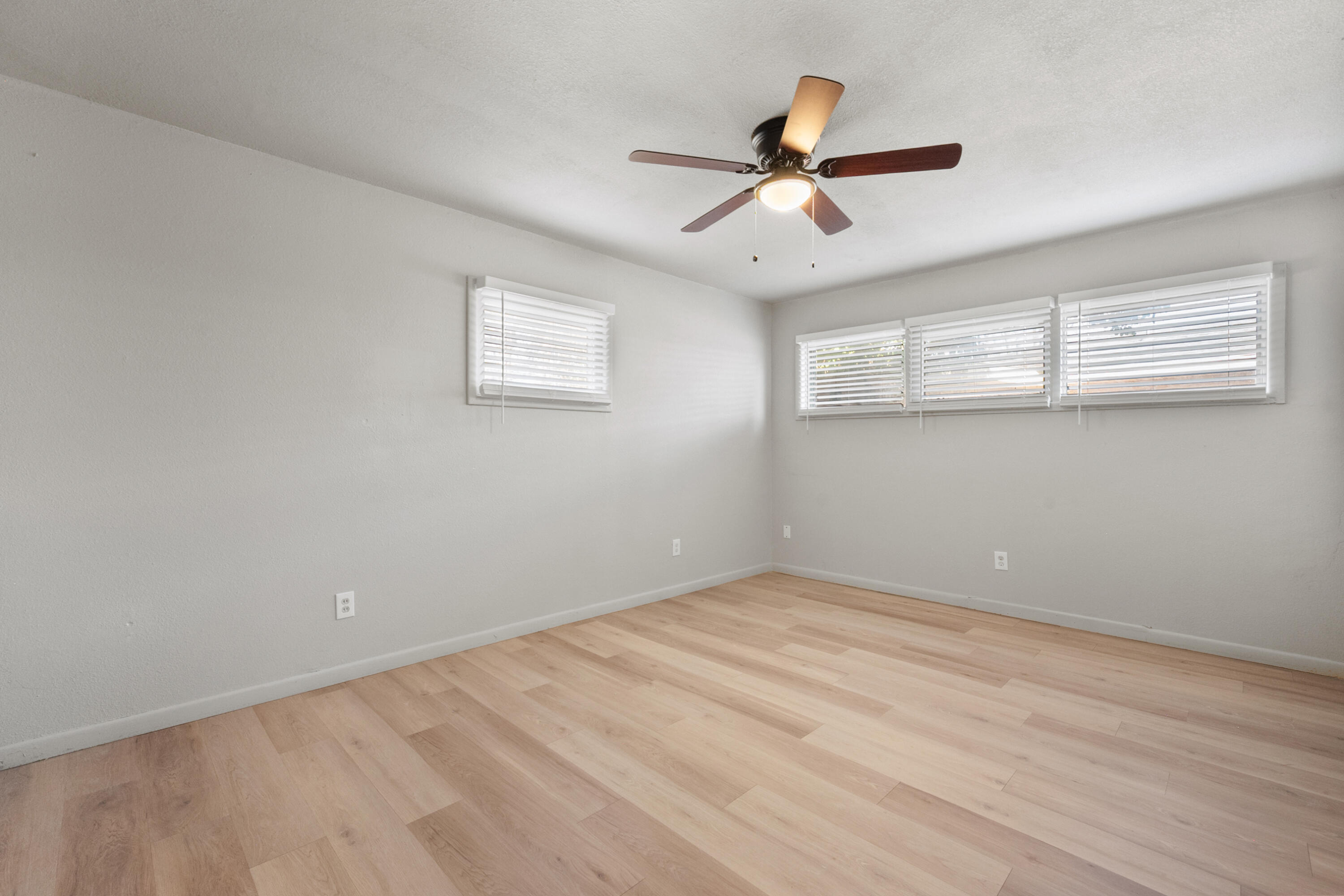 2504 53rd Street Lubbock, TX 79413 - Photo 20 of 28 a view of a big room with wooden floor closet and windows
