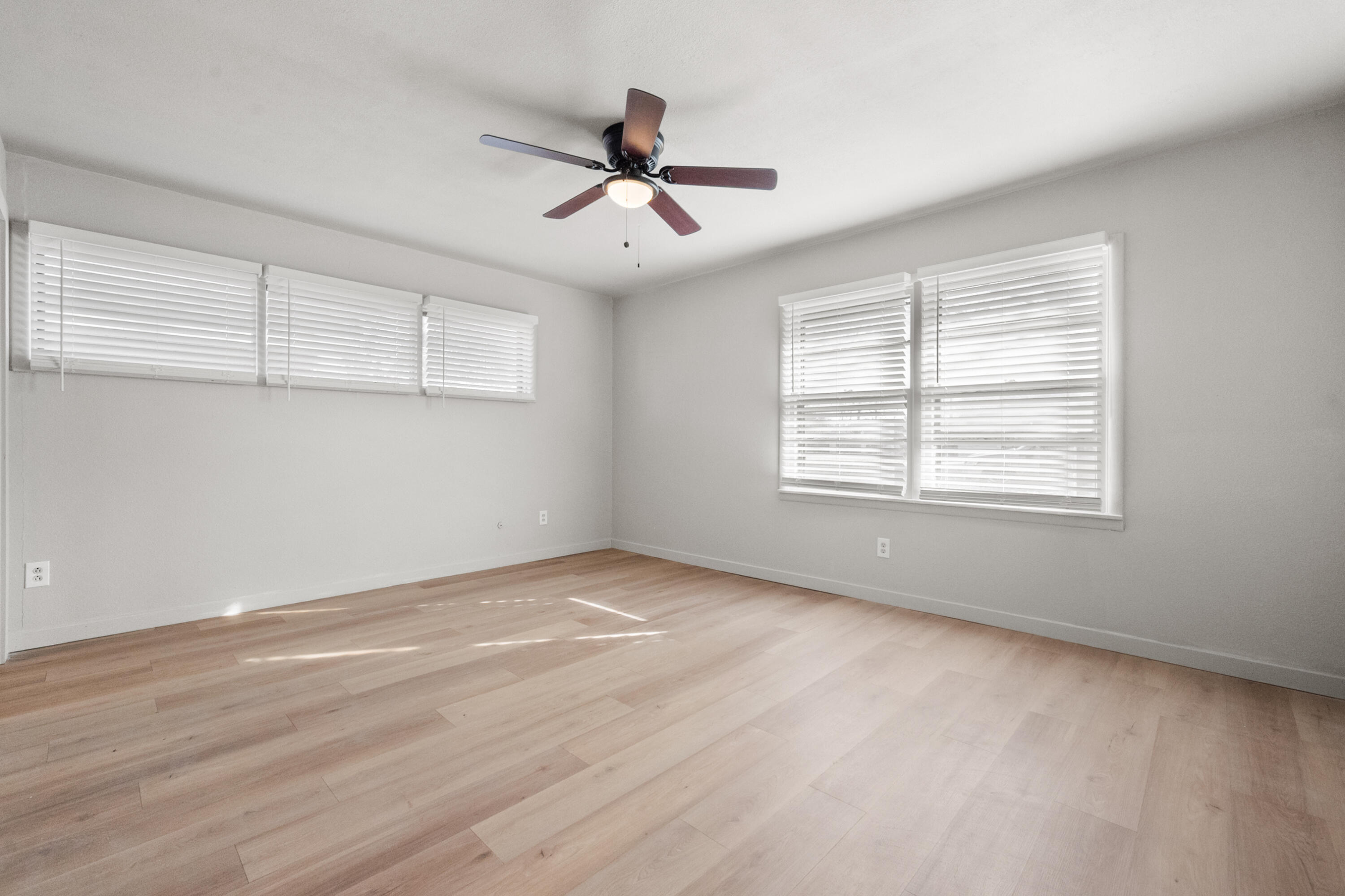 2504 53rd Street Lubbock, TX 79413 - Photo 25 of 28 wooden floor in an empty room with a window