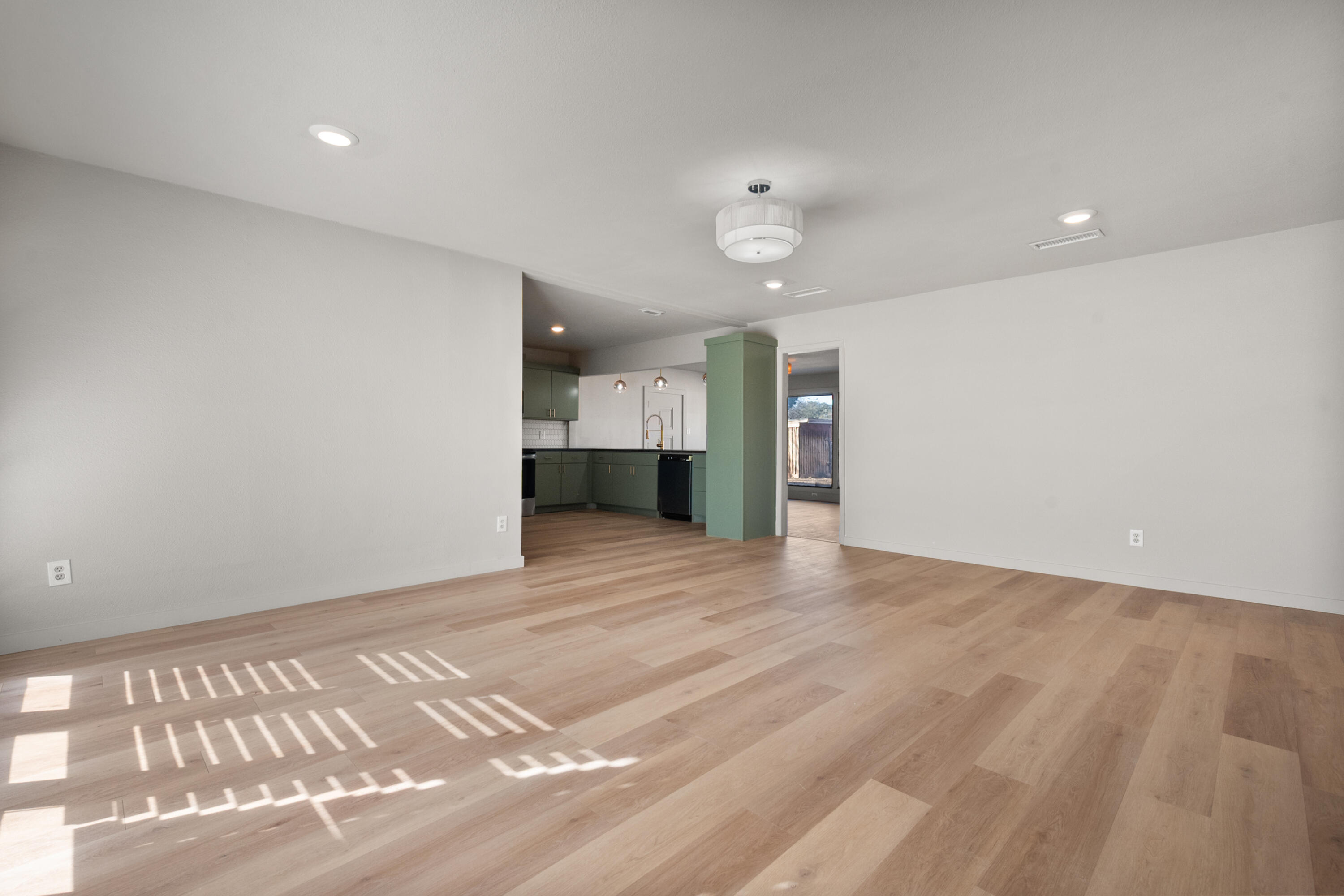 2504 53rd Street Lubbock, TX 79413 - Photo 5 of 28 wooden floor in an empty room with a window