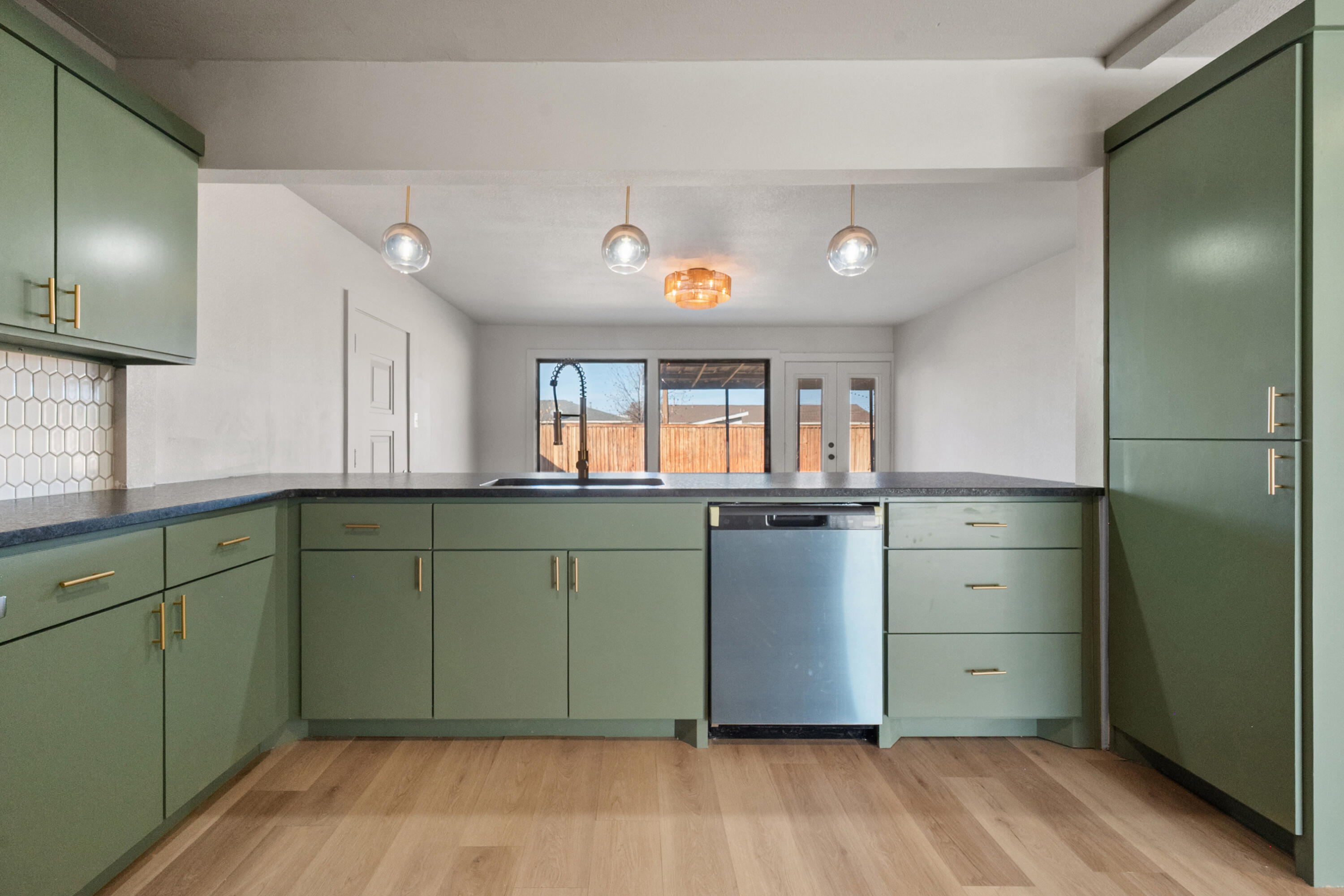 2504 53rd Street Lubbock, TX 79413 - Photo 6 of 28 a kitchen with a refrigerator and window