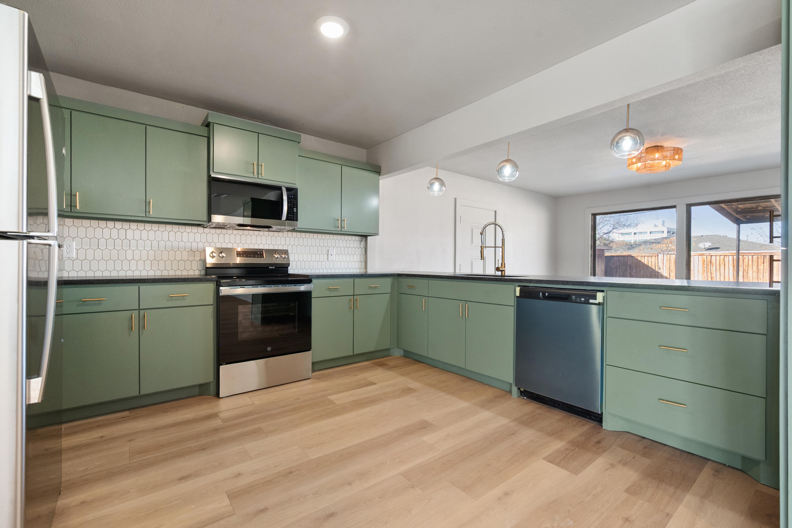 2504 53rd Street Lubbock, TX 79413 - Photo 8 of 28 a kitchen with a sink and a stove top oven