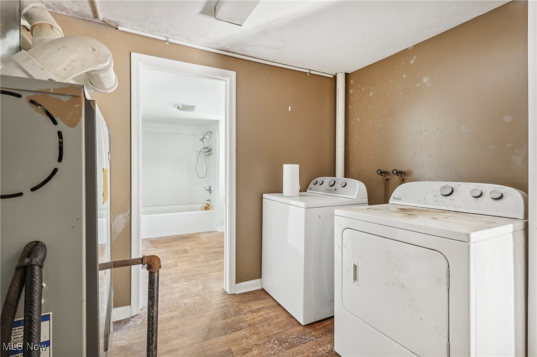 1733 Ronald Road Akron, OH 44312 - Photo 20 of 33 Clothes washing area featuring wood-type flooring and independent washer and dryer