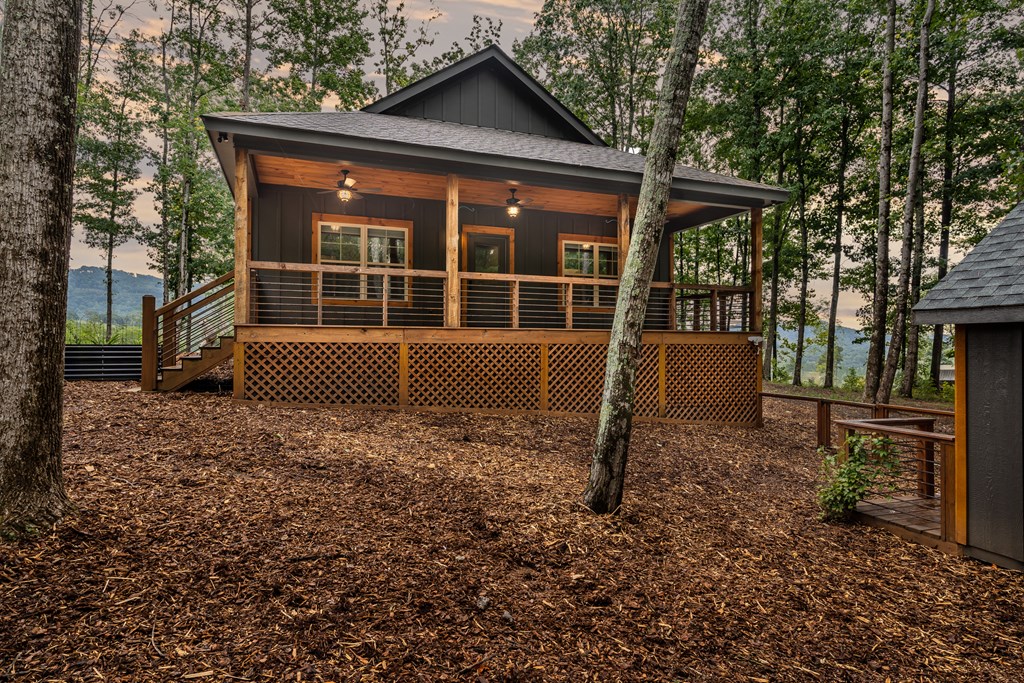 1450 Twisted Oak Road Talking Rock, GA 30175 - Photo 43 of 59 a house view with a garden space