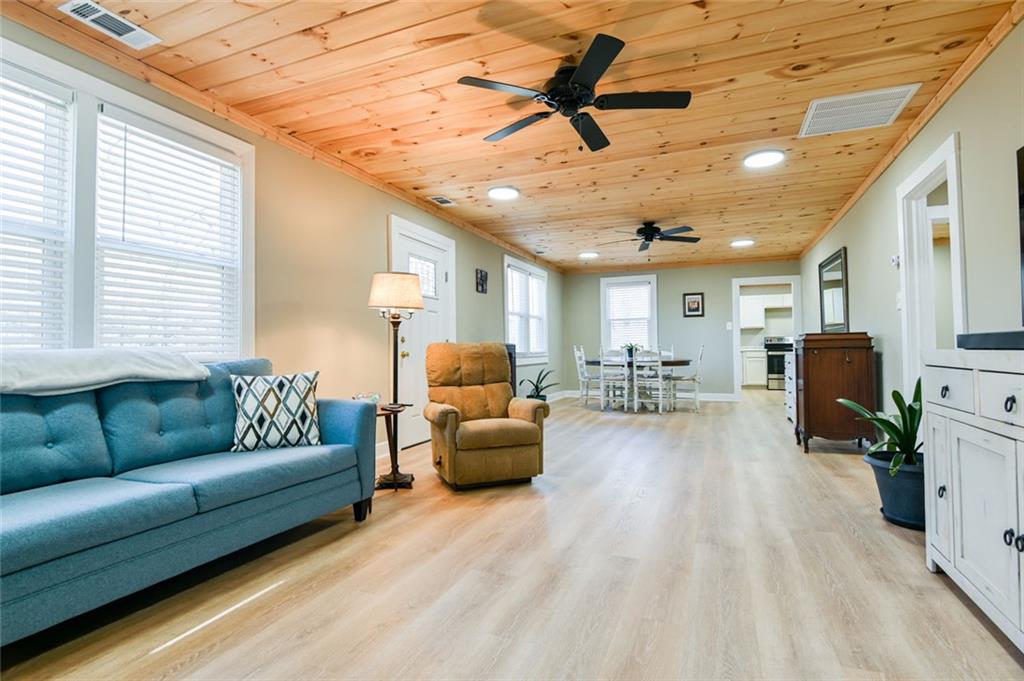 1160 Moody Street Union Point, GA 30669 - Photo 11 of 39 a living room with furniture and a large window