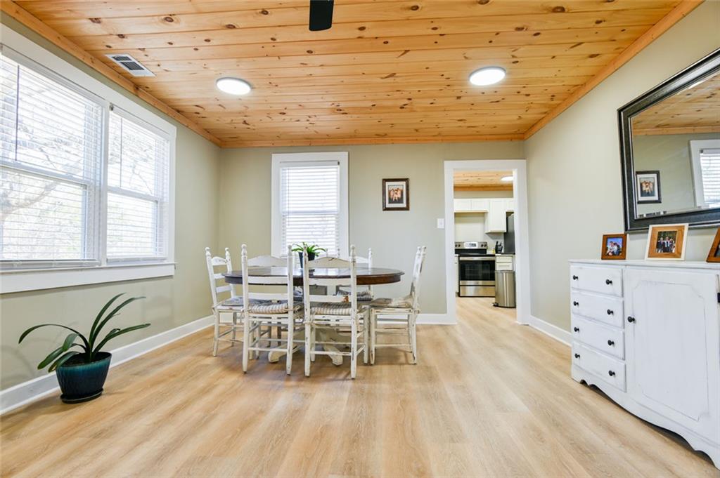 1160 Moody Street Union Point, GA 30669 - Photo 13 of 39 a dining room with furniture and wooden floor