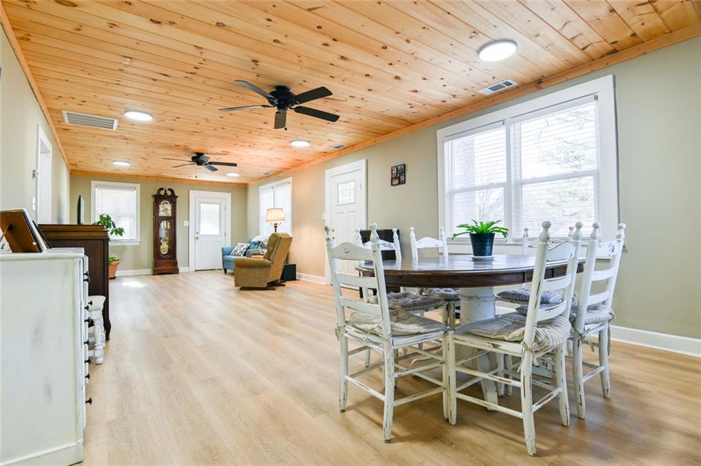 1160 Moody Street Union Point, GA 30669 - Photo 14 of 39 a view of a dining room with furniture window and wooden floor