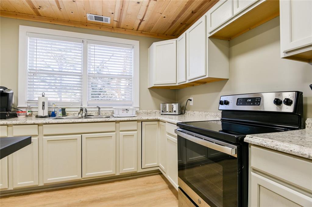 1160 Moody Street Union Point, GA 30669 - Photo 16 of 39 a kitchen with a stove and a sink
