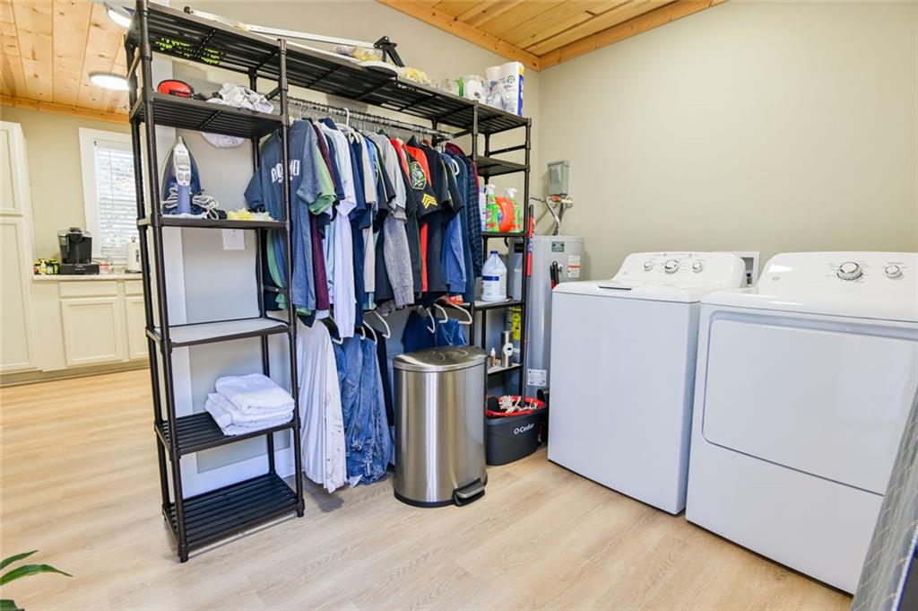 1160 Moody Street Union Point, GA 30669 - Photo 20 of 39 a view of walk in closet with clothes and shoes