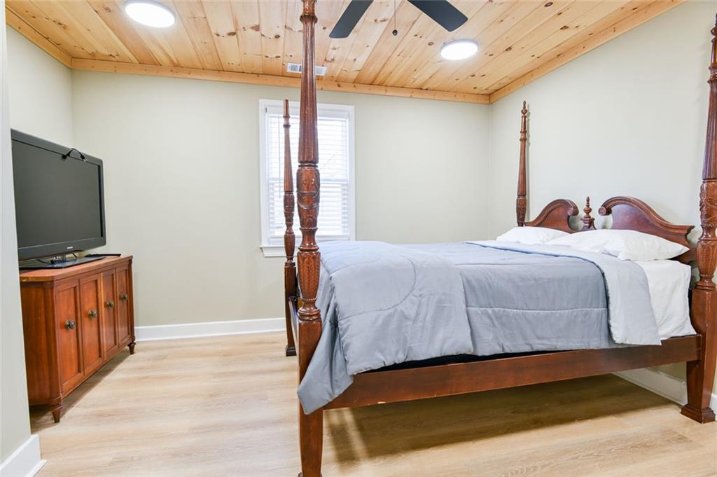 1160 Moody Street Union Point, GA 30669 - Photo 23 of 39 a bedroom with a bed and a flat screen tv