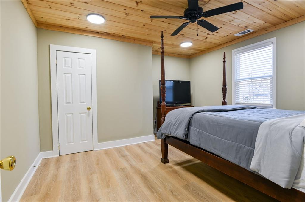 1160 Moody Street Union Point, GA 30669 - Photo 27 of 39 a bed sitting in a spacious bedroom next to a window
