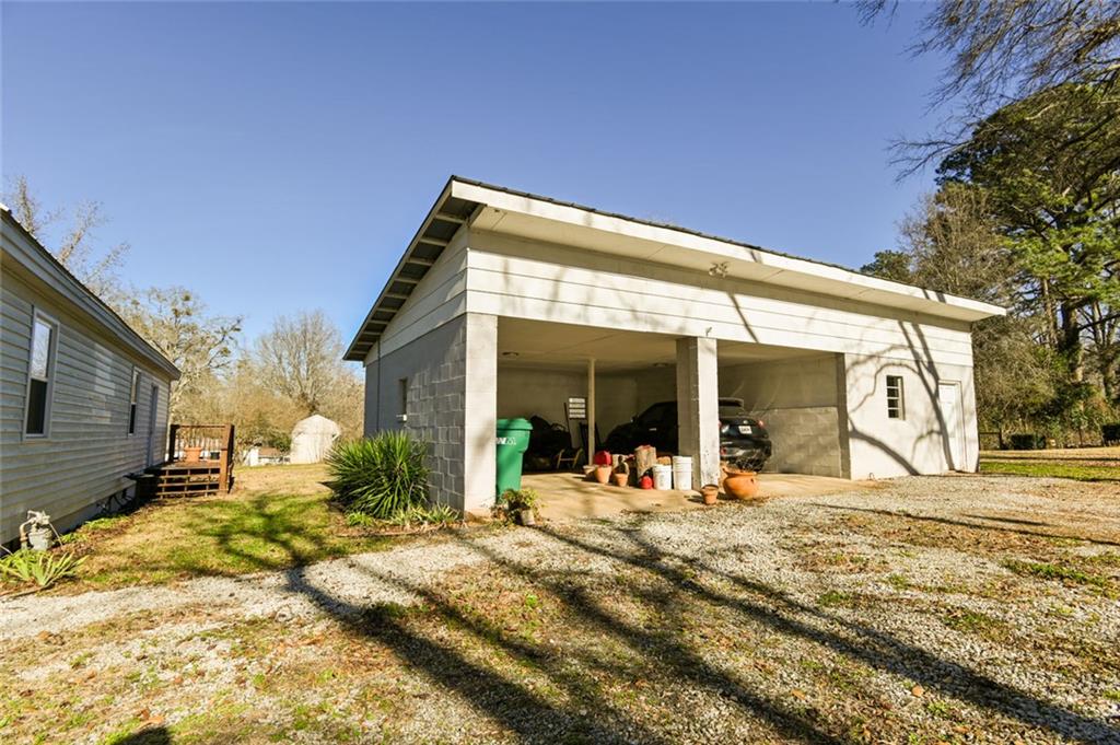1160 Moody Street Union Point, GA 30669 - Photo 34 of 39 a view of a house with snow on the wall