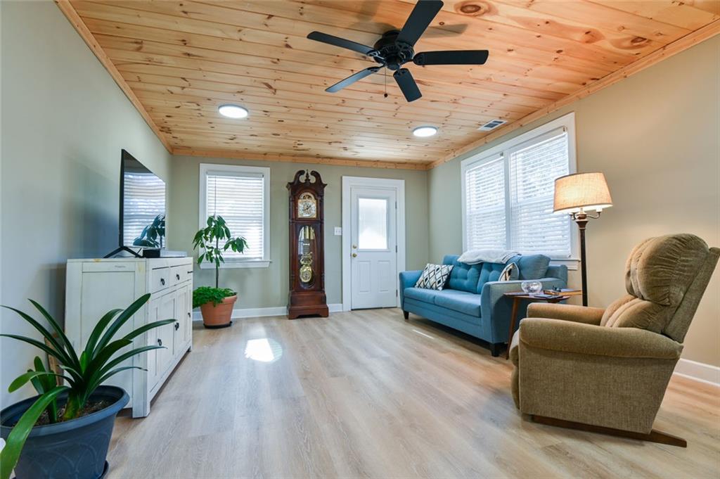 1160 Moody Street Union Point, GA 30669 - Photo 8 of 39 a living room with furniture and a potted plant
