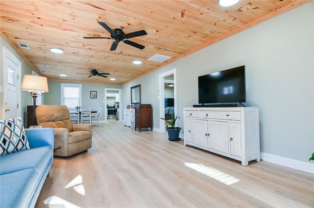 1160 Moody Street Union Point, GA 30669 - Photo 9 of 39 a living room with furniture and a flat screen tv