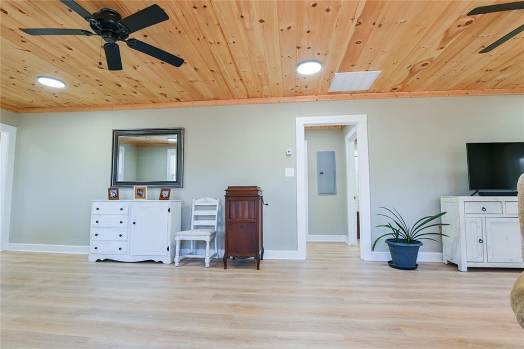 1160 Moody Street Union Point, GA 30669 - Photo 10 of 39 a view of a livingroom with furniture and a flat screen tv