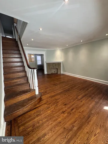 a view of an entryway with wooden floor