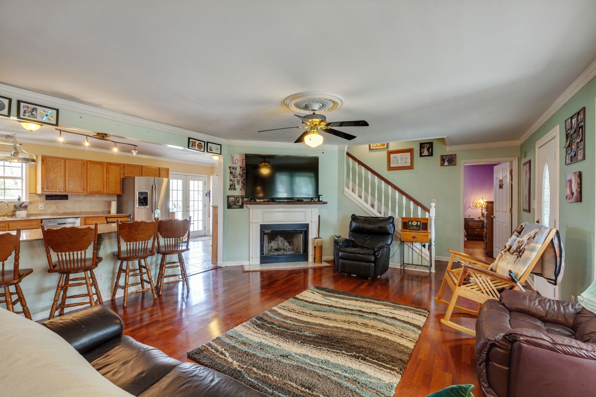 1370 McCool Road Lewisburg, TN 37091 - Photo 7 of 19 a view of a livingroom with furniture a fireplace chandeliers
