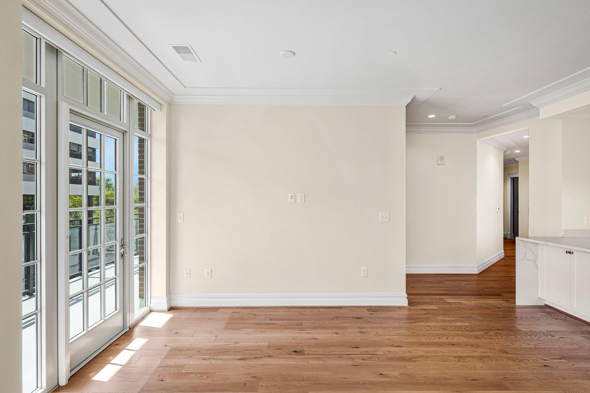 6900 Fleetwood Road, Unit 318 McLean, VA 22101 - Photo 14 of 63 a view of an empty room with wooden floor and a window