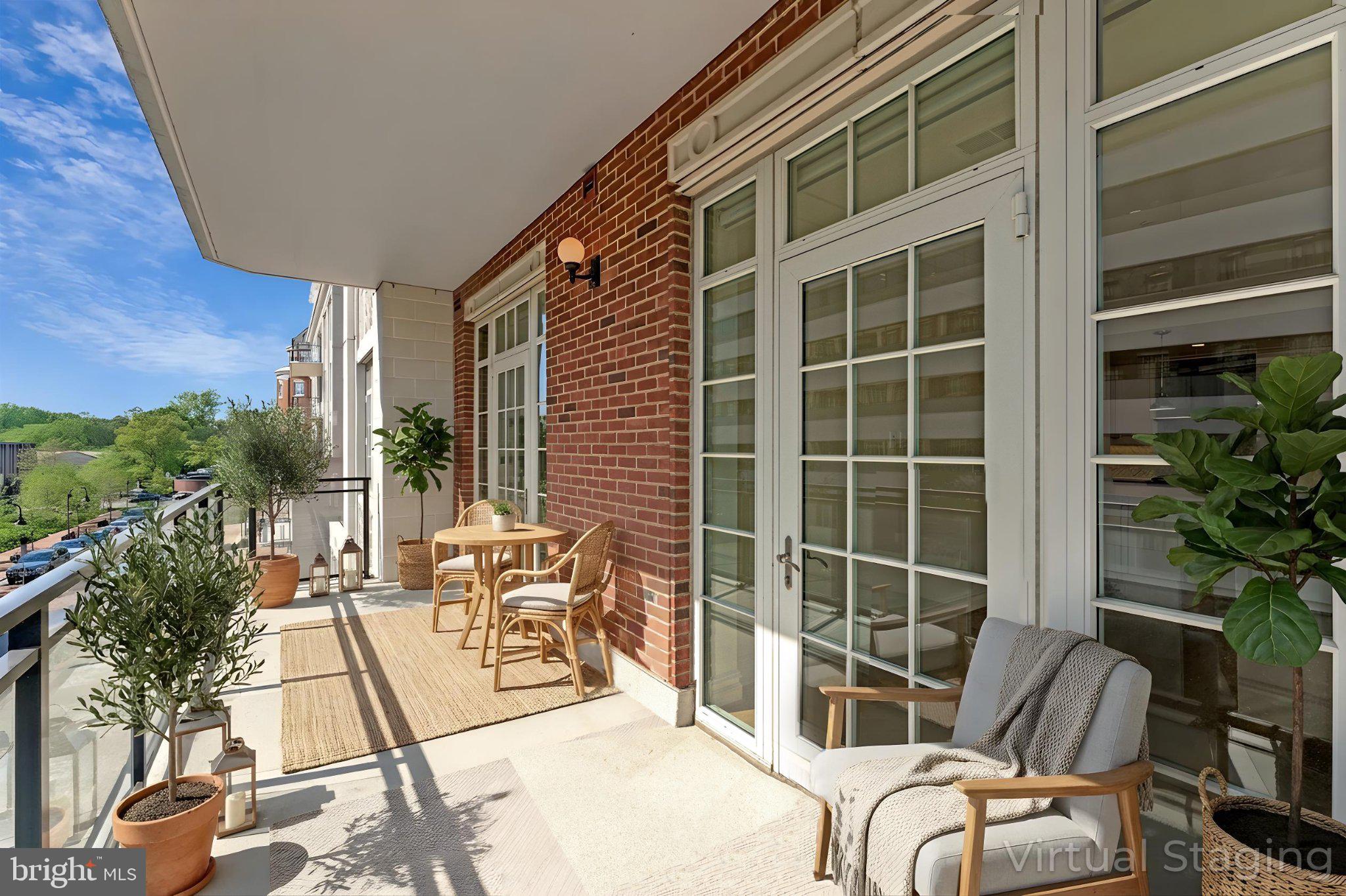 6900 Fleetwood Road, Unit 318 McLean, VA 22101 - Photo 17 of 63 Sunny balcony with lush greenery.