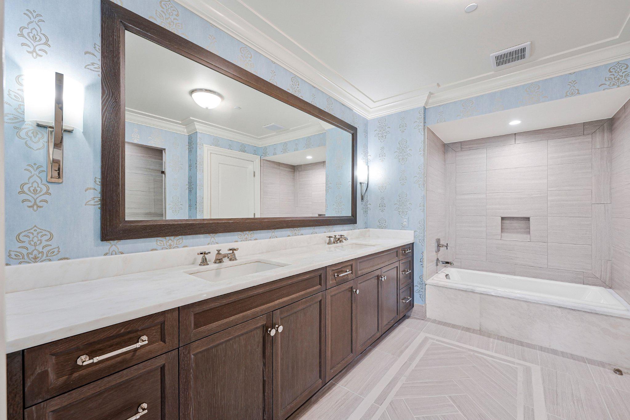 6900 Fleetwood Road, Unit 318 McLean, VA 22101 - Photo 23 of 63 a spacious bathroom with a double vanity sink and mirror with bathtub