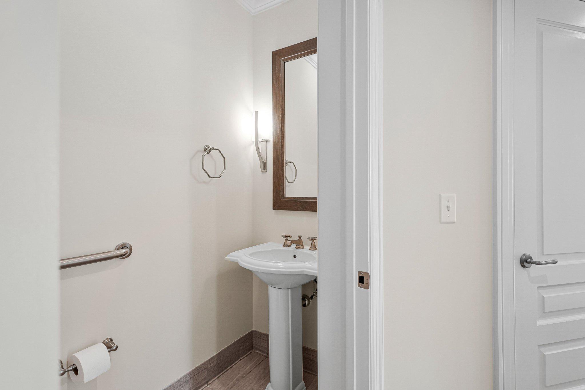 6900 Fleetwood Road, Unit 318 McLean, VA 22101 - Photo 33 of 63 a bathroom with a sink and mirror