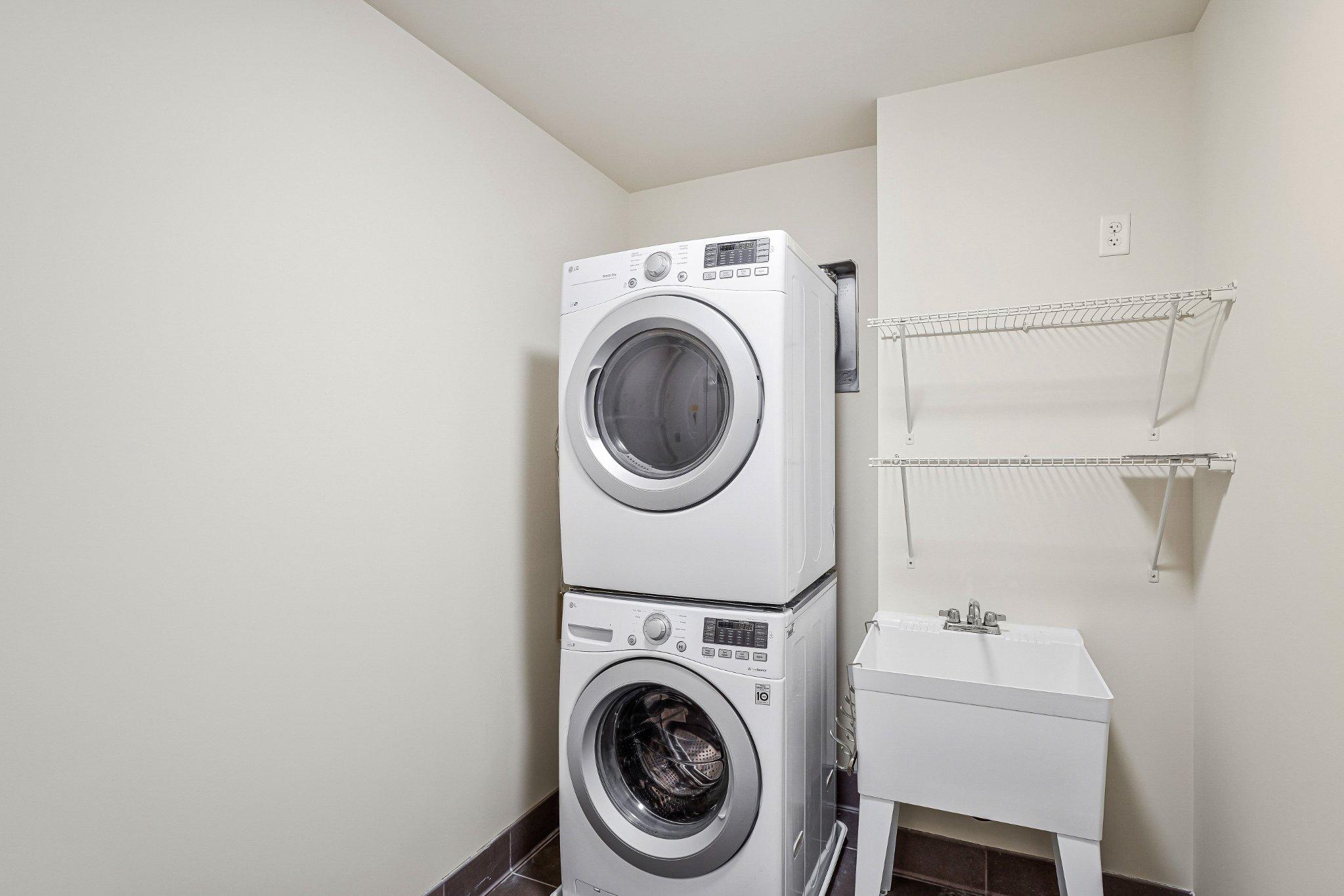 6900 Fleetwood Road, Unit 318 McLean, VA 22101 - Photo 34 of 63 a utility room with dryer and washer