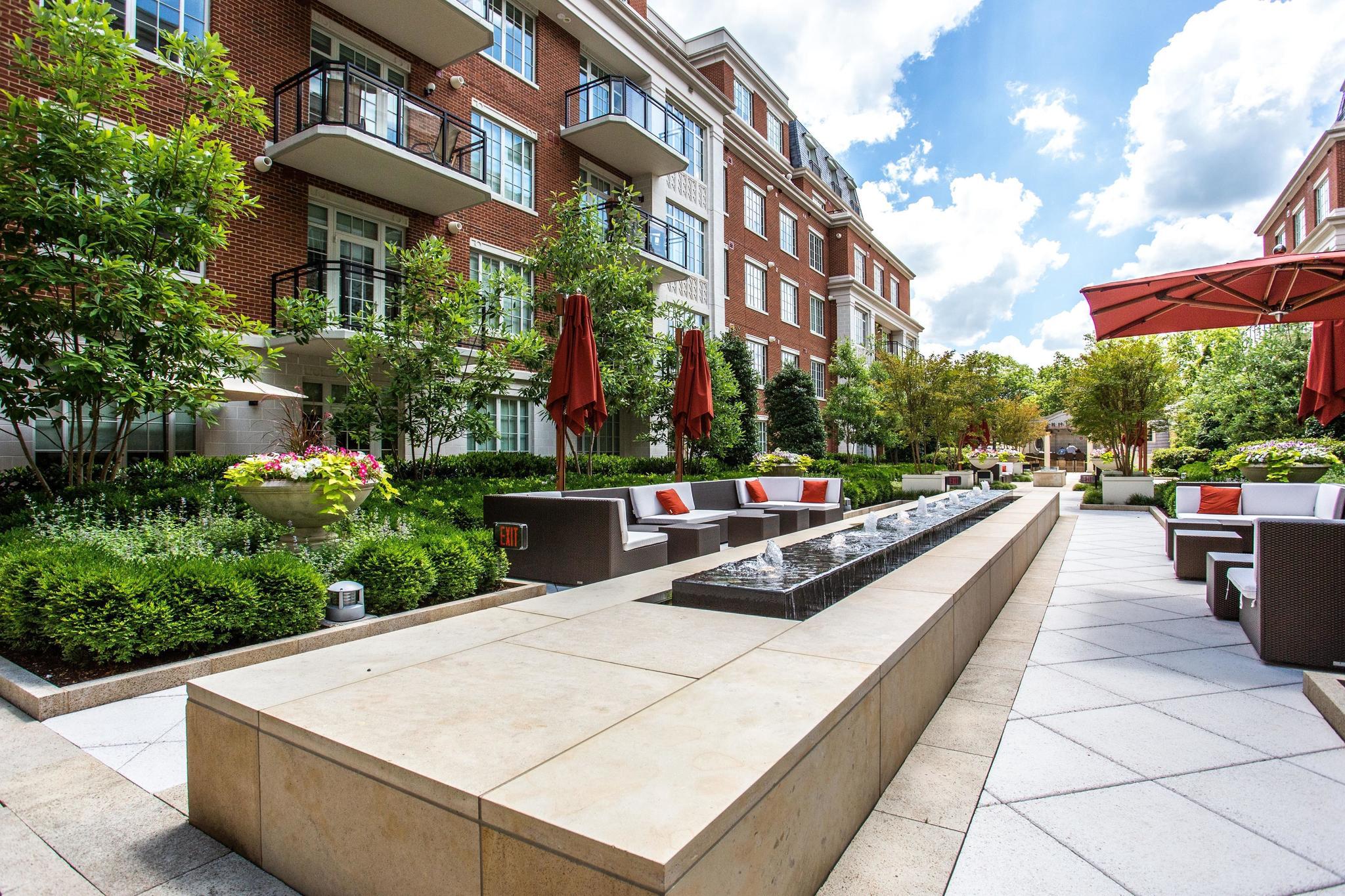 6900 Fleetwood Road, Unit 318 McLean, VA 22101 - Photo 50 of 63 a swimming pool with outdoor seating and yard