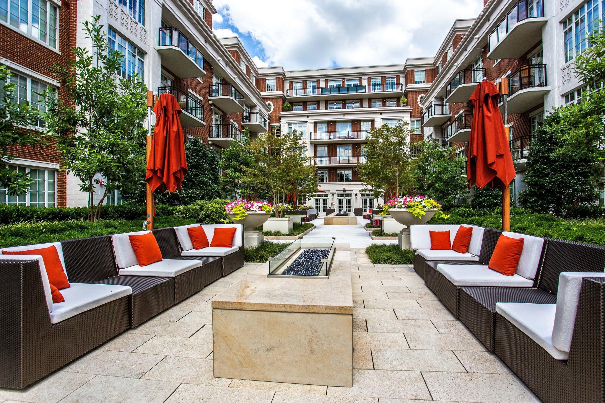 6900 Fleetwood Road, Unit 318 McLean, VA 22101 - Photo 51 of 63 a view of patio with couches and a fire pit