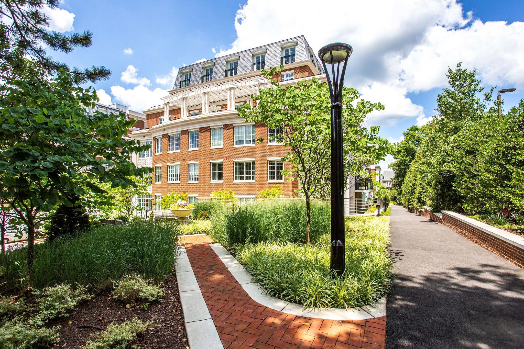 6900 Fleetwood Road, Unit 318 McLean, VA 22101 - Photo 57 of 63 a front view of a building with garden