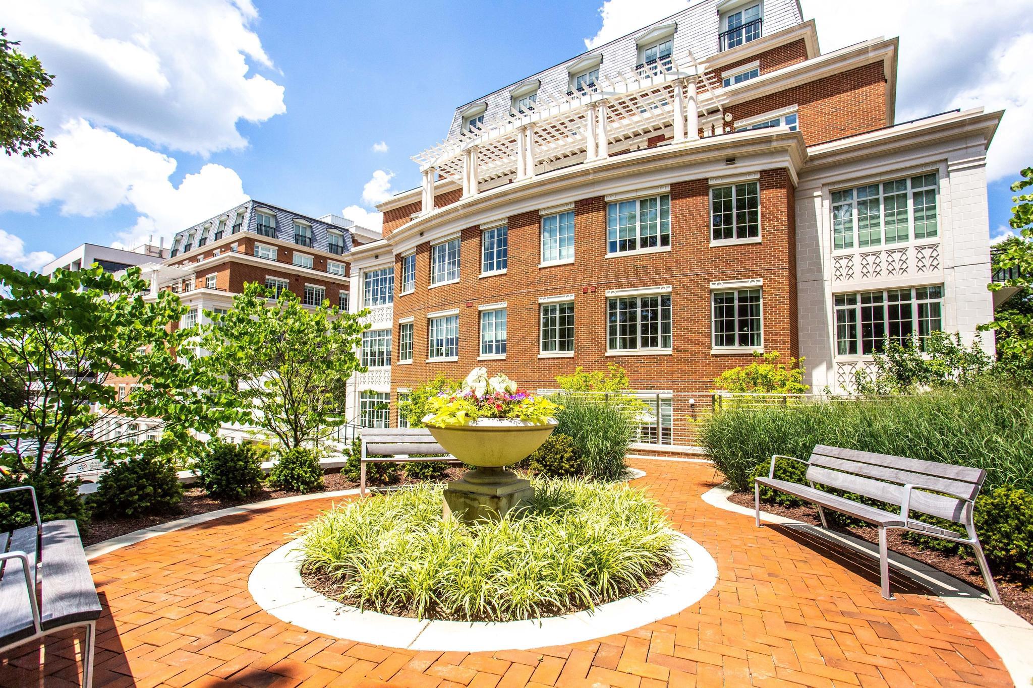 6900 Fleetwood Road, Unit 318 McLean, VA 22101 - Photo 58 of 63 a view of a swimming pool with a lounge chairs in patio