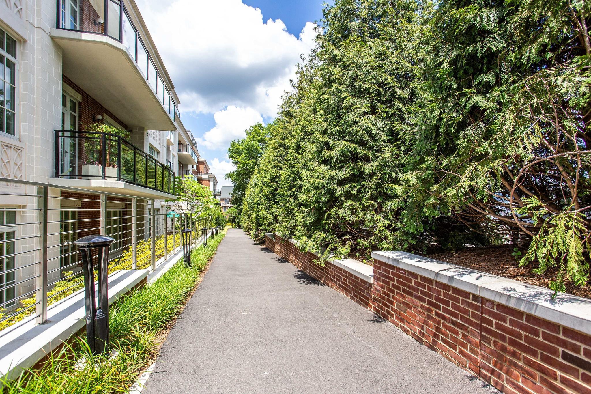 6900 Fleetwood Road, Unit 318 McLean, VA 22101 - Photo 60 of 63 a view of a pathway with a flower garden