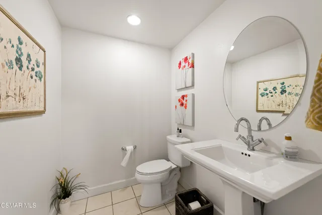 a view of a chairs and table in the balcony