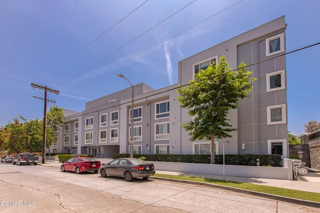 a living room with furniture and a pool table