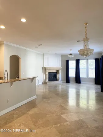a view of a kitchen with a sink and a fireplace
