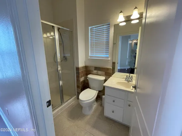 a bathroom with a bathtub and shower