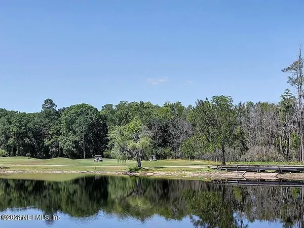 a front view of house with yard slide and outdoor seating