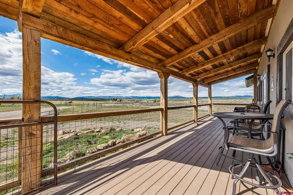 a view of outdoor space with wooden floor and city view